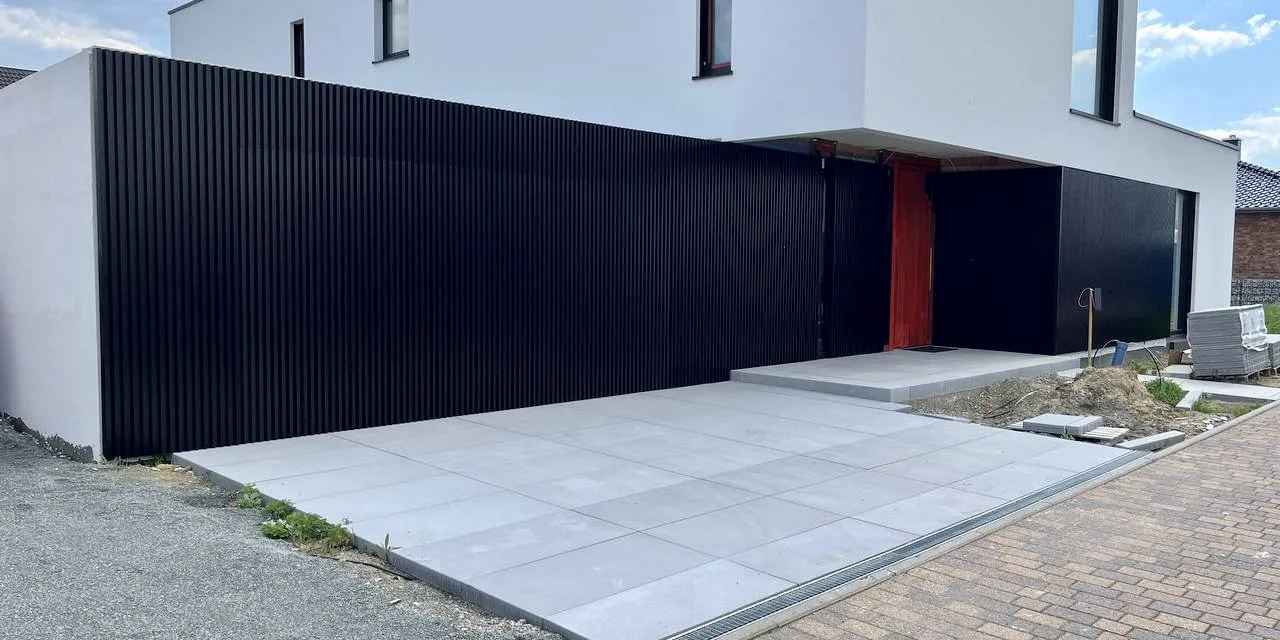 The magic invisible garage doors with linarte wall cladding