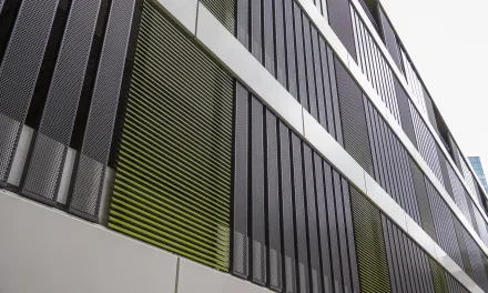 Parking garage slatted façade: Renson Linius L.050 slat & perforated sheet metal panels